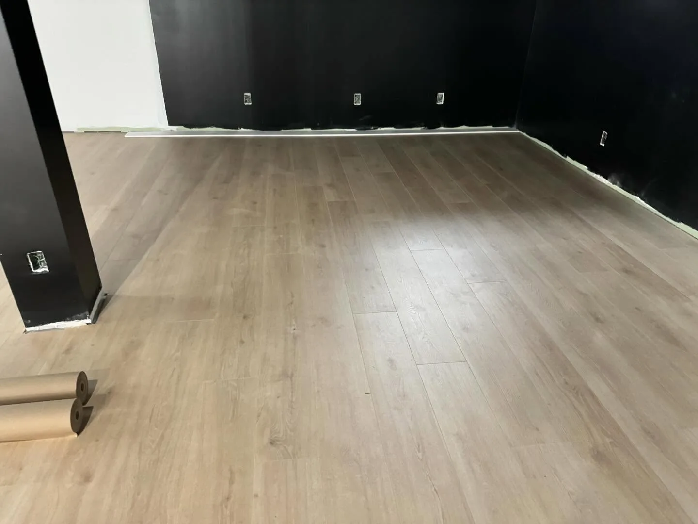 Residential vinyl flooring installation completed in finished room section